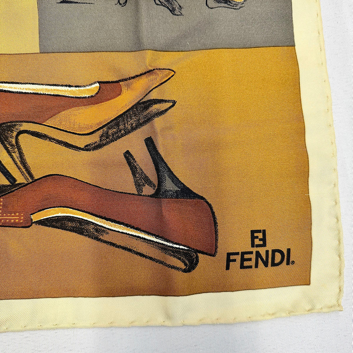 Fendi Scarf Featuring a Collage of Fendi Elements