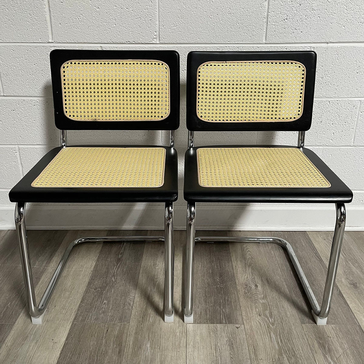 Pair of Black and Rattan Breuer Style Chairs