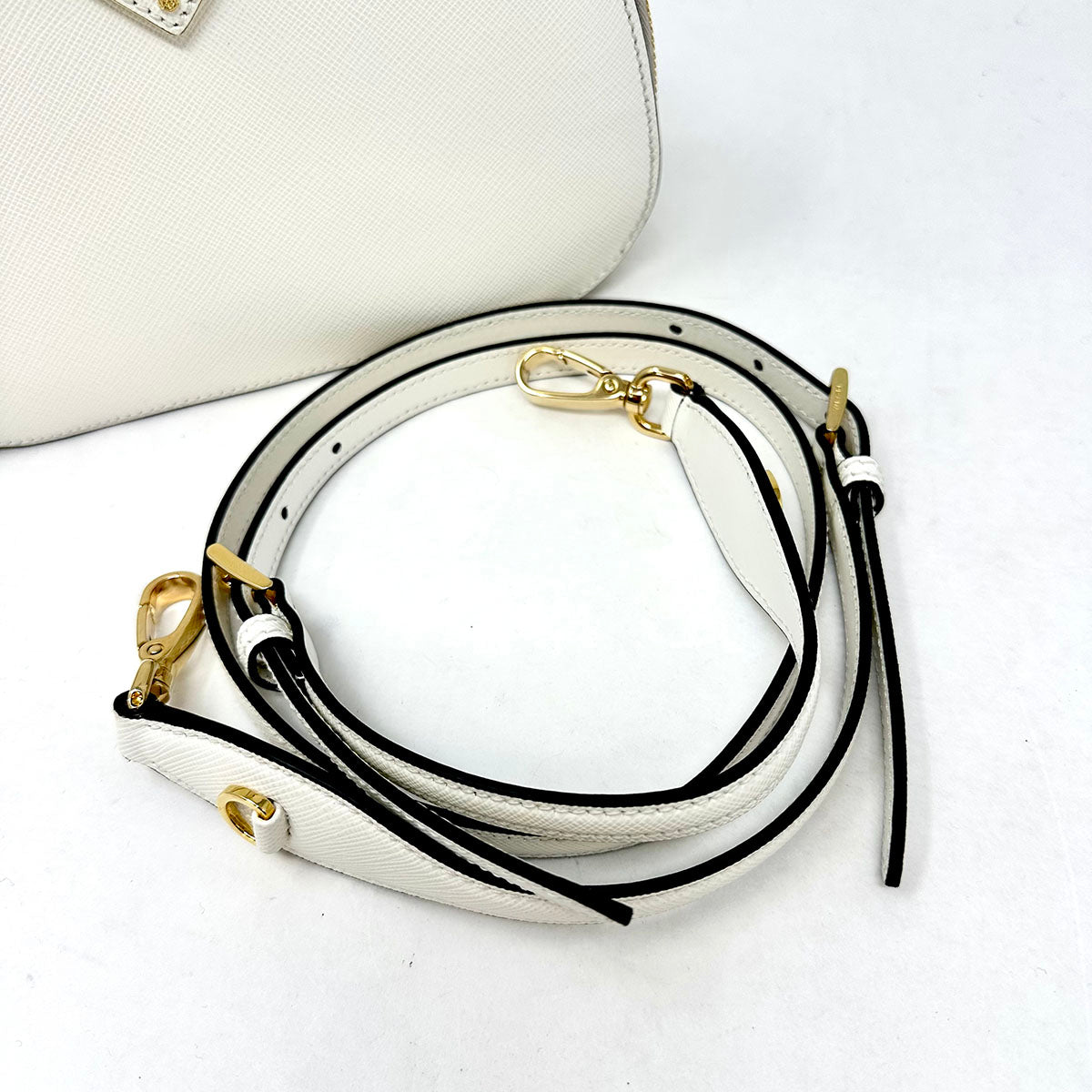 Prada Enameled Metal Triangle Odette Crossbody
