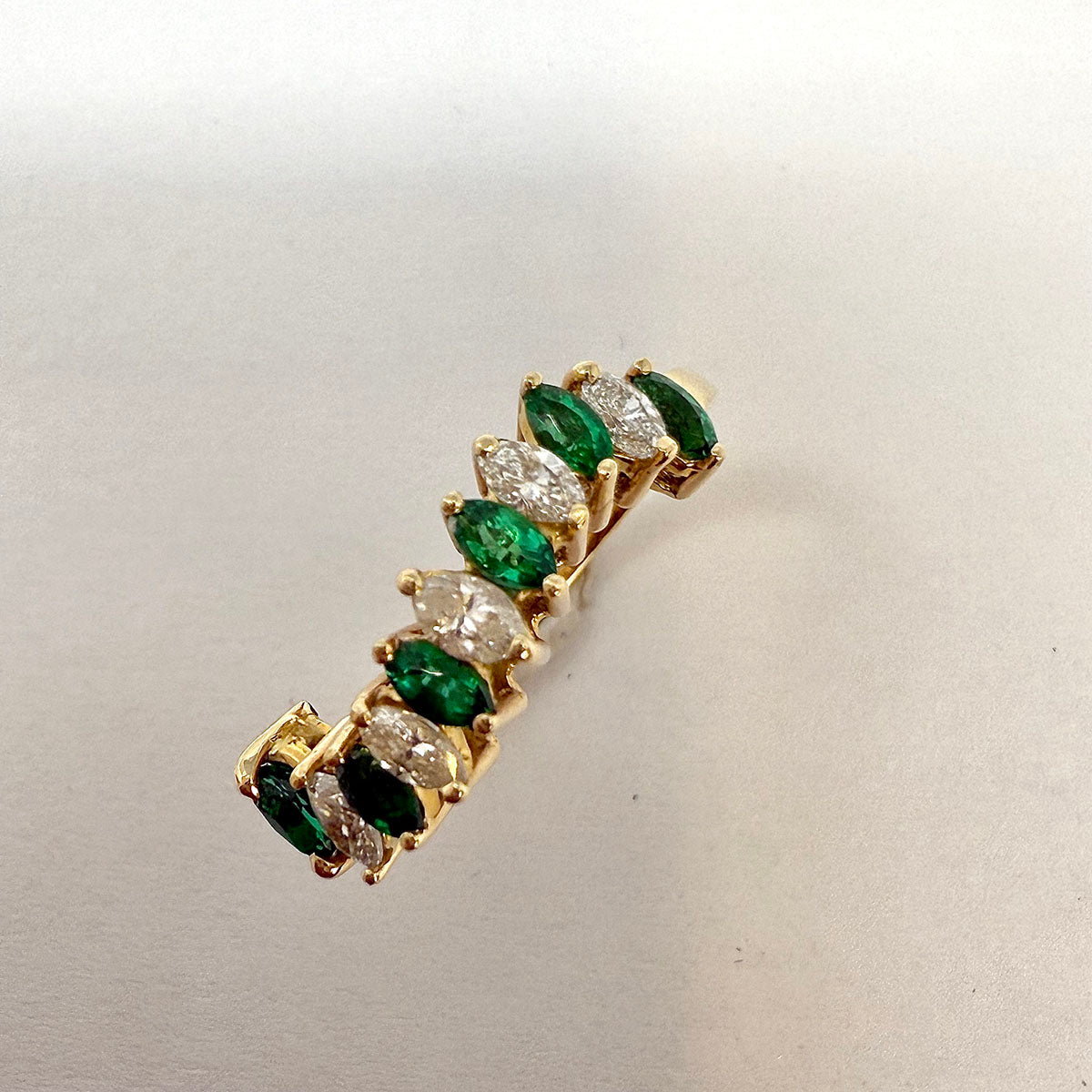 18K Gold Wavy Ring with 6 Emeralds and 5 Marquise Diamonds