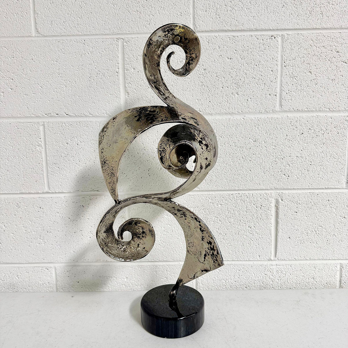 Abstract Brutalist Metal Ribbon Sculpture on base