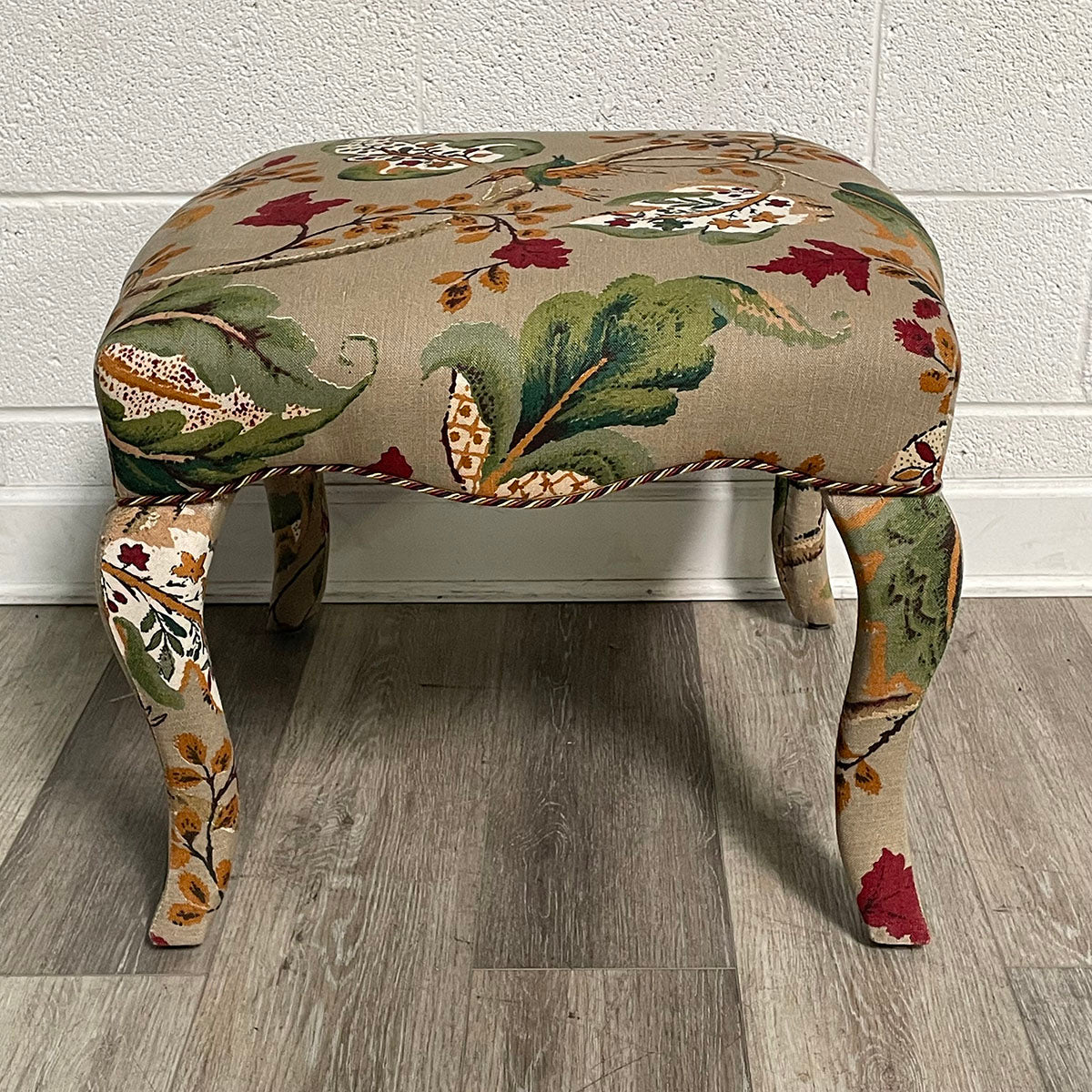 Upholstered Ottoman with Curved Legs and Botanical Print