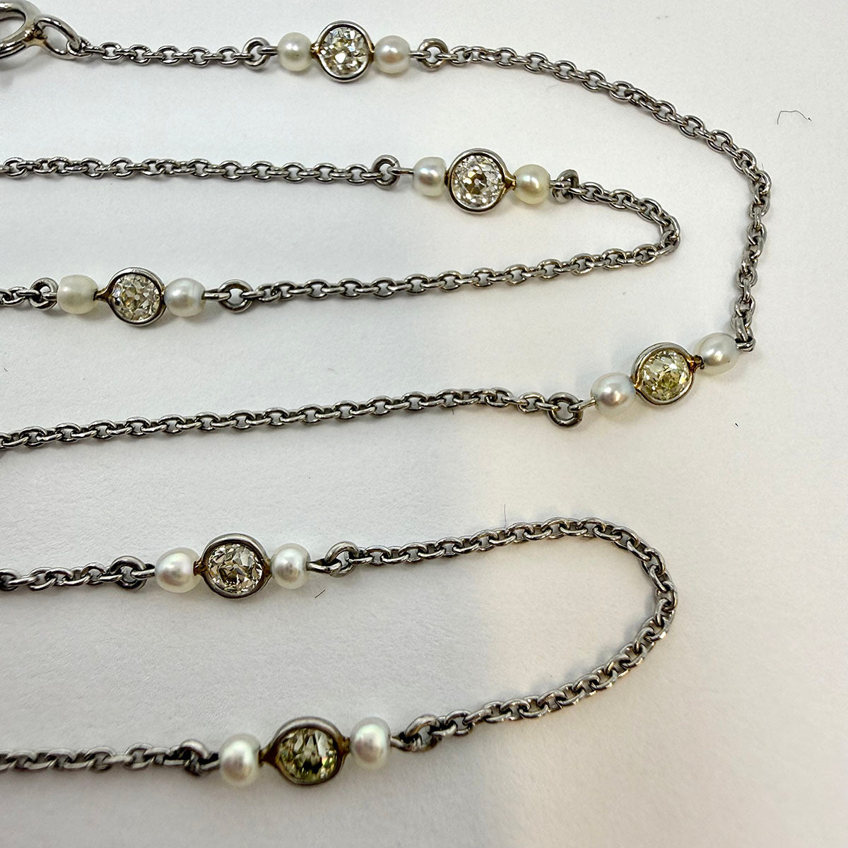 Platinum Necklace with 9 Round Bezel Set Diamonds and 18 Small Cultured Pearls