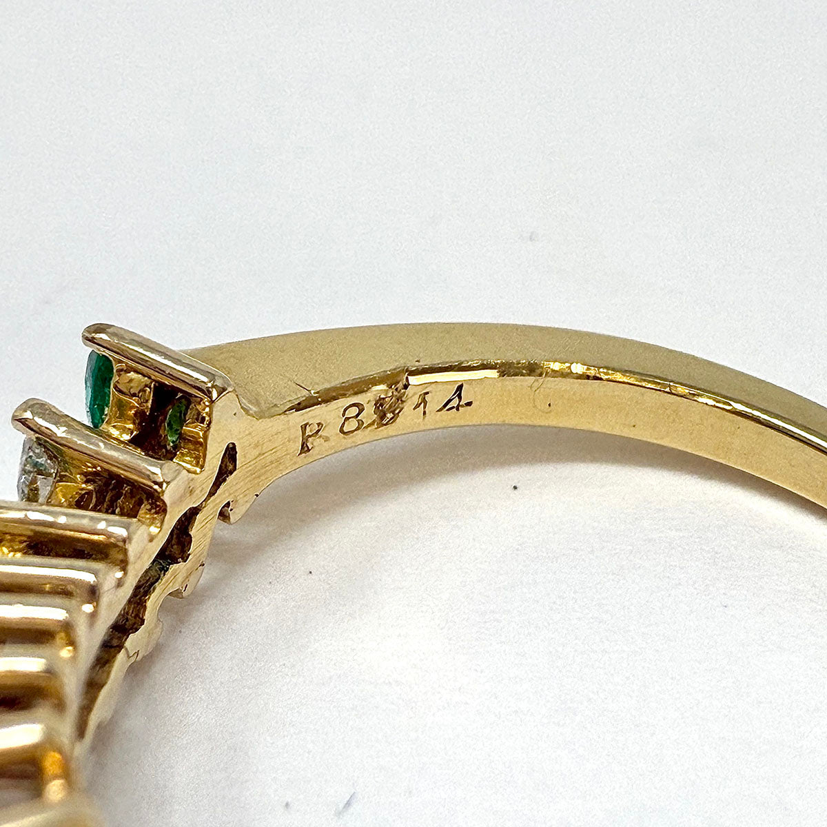 18K Gold Wavy Ring with 6 Emeralds and 5 Marquise Diamonds