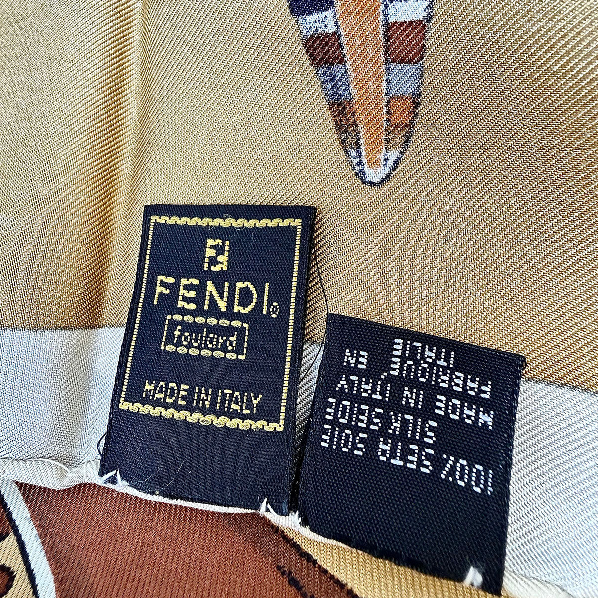 Fendi Scarf Featuring a Collage of Fendi Elements