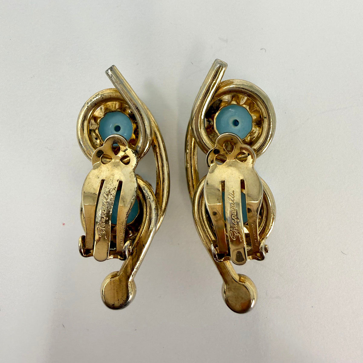 Signed Schiaparelli Clip-on Earrings with 2 Ribbed Stones