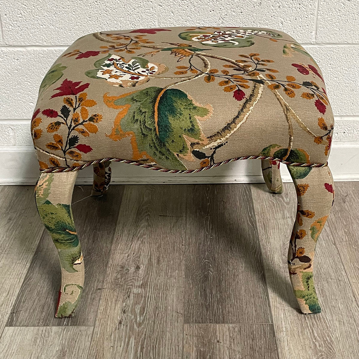 Upholstered Ottoman with Curved Legs and Botanical Print