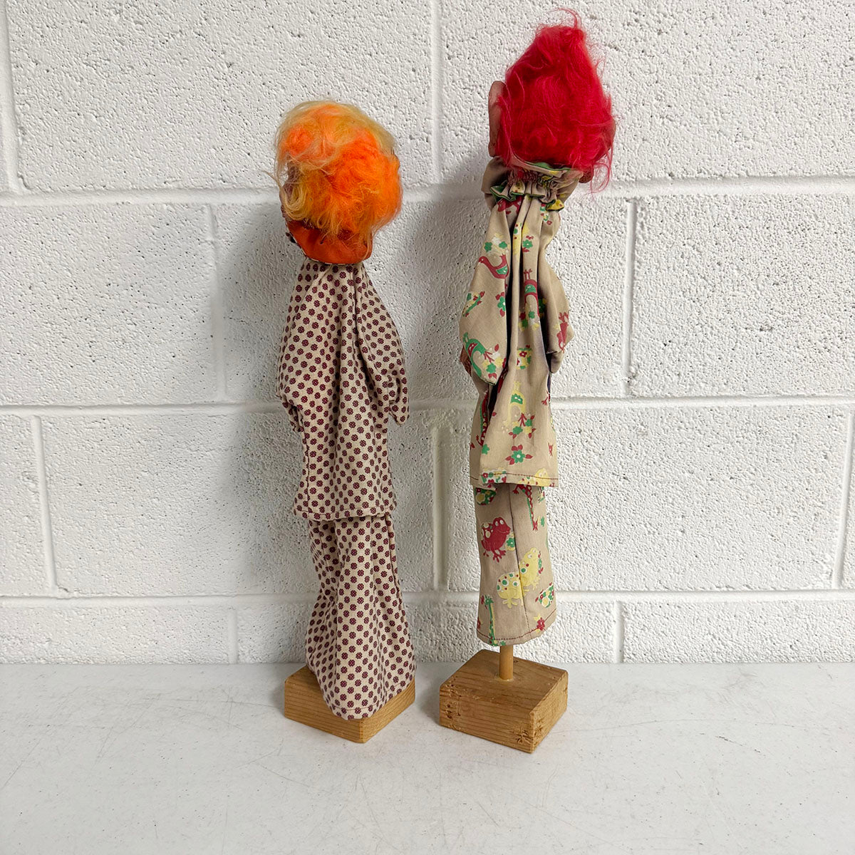 A Pair of Folk Art Clown Puppets on stand