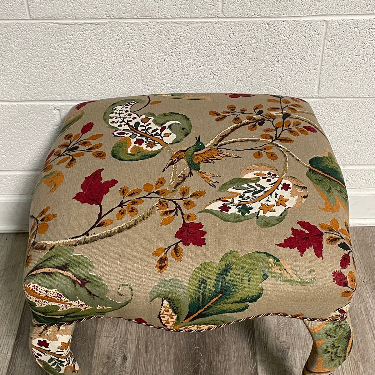 Upholstered Ottoman with Curved Legs and Botanical Print
