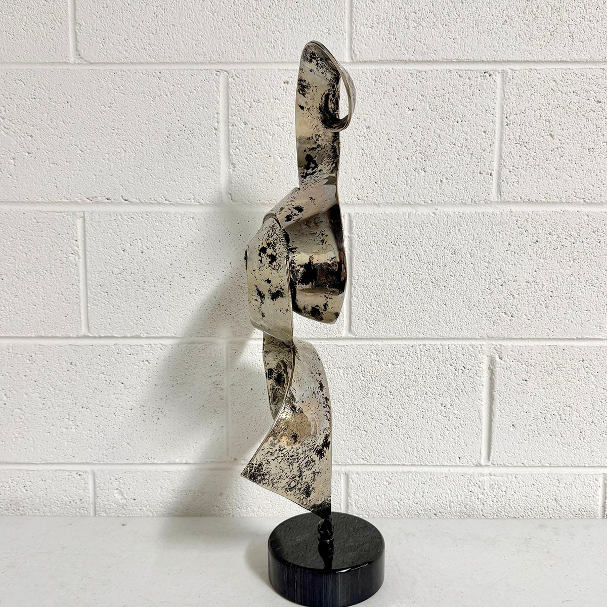 Abstract Brutalist Metal Ribbon Sculpture on base