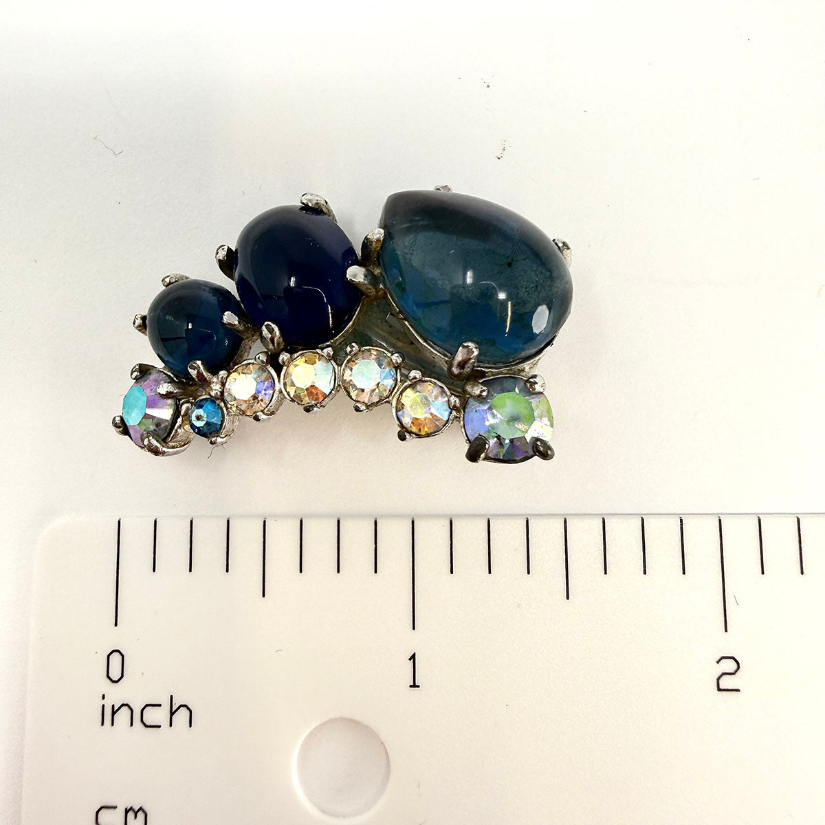 Signed Schiaparelli Curved Clip-on Earrings with Blue Rhinestones