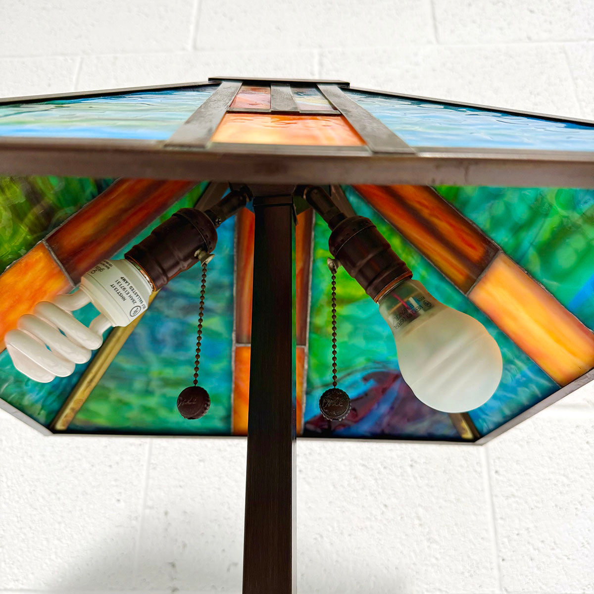 Pair of Tiffany-style mission stained glass table lamp with a bronze-like base
