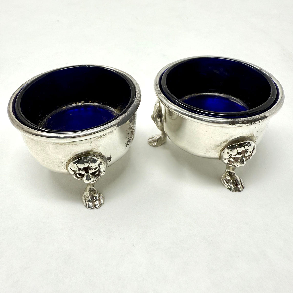Pair of Glass Lined Repousse Sterling Salt Cellers