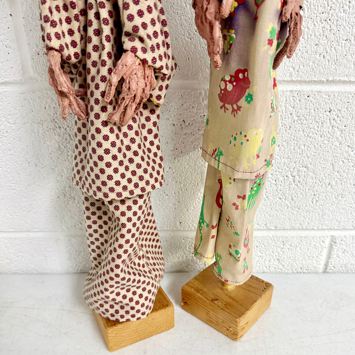 A Pair of Folk Art Clown Puppets on stand