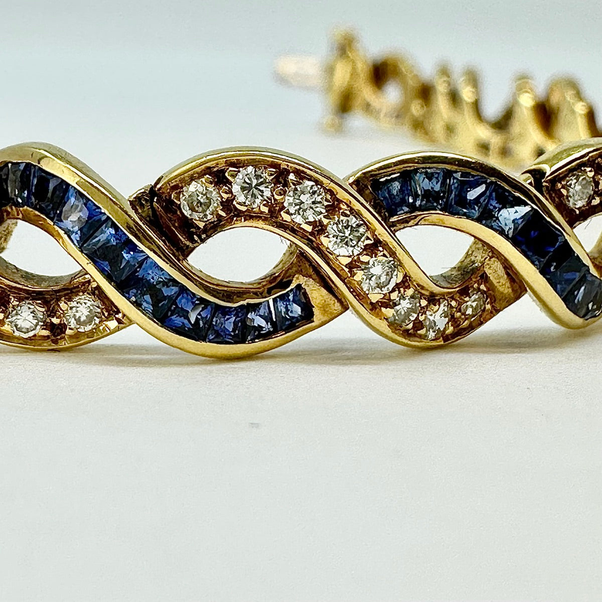 18K Gold Twist 5.25ct Sapphire and 1.54ct. Diamond Tennis Bracelet
