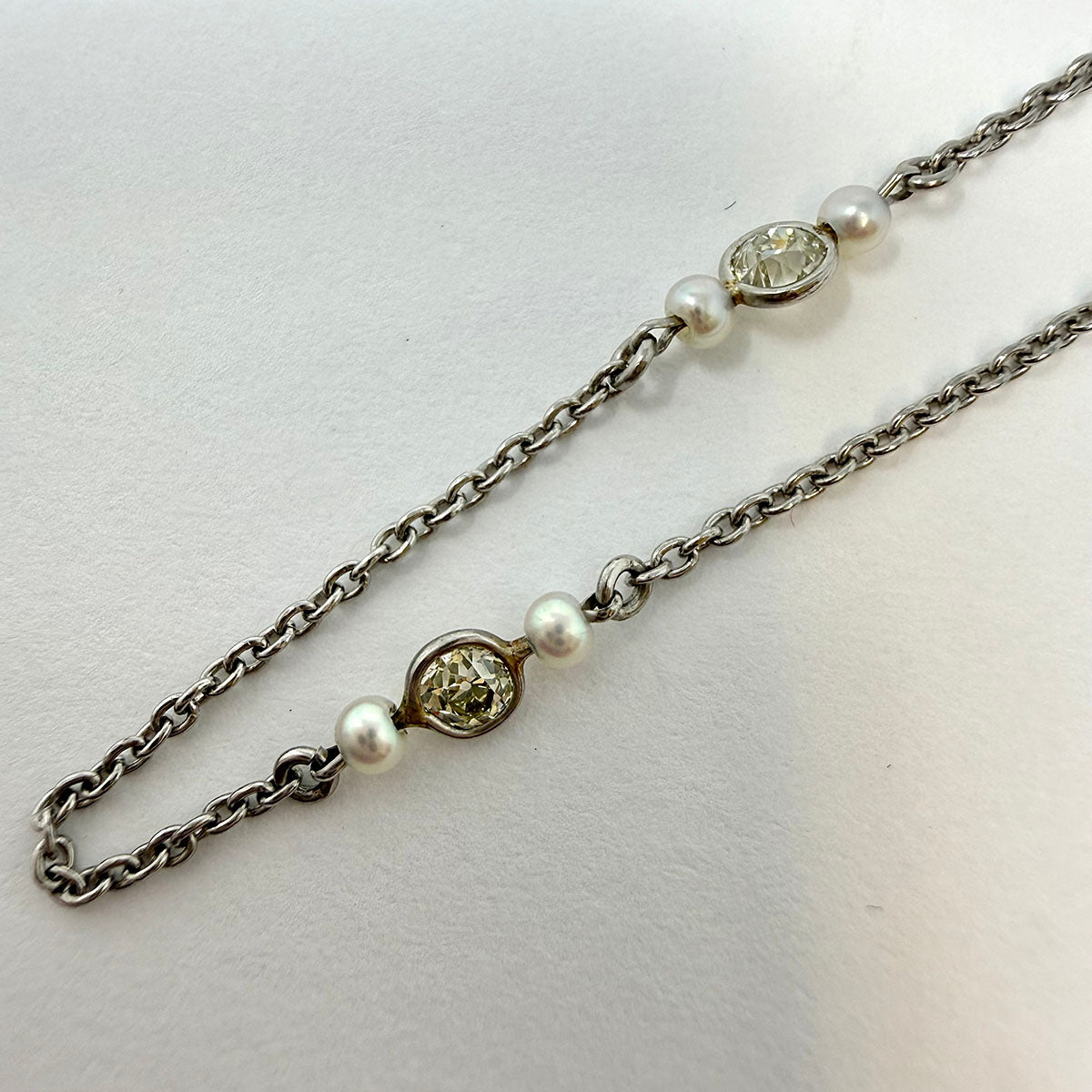 Platinum Necklace with 9 Round Bezel Set Diamonds and 18 Small Cultured Pearls