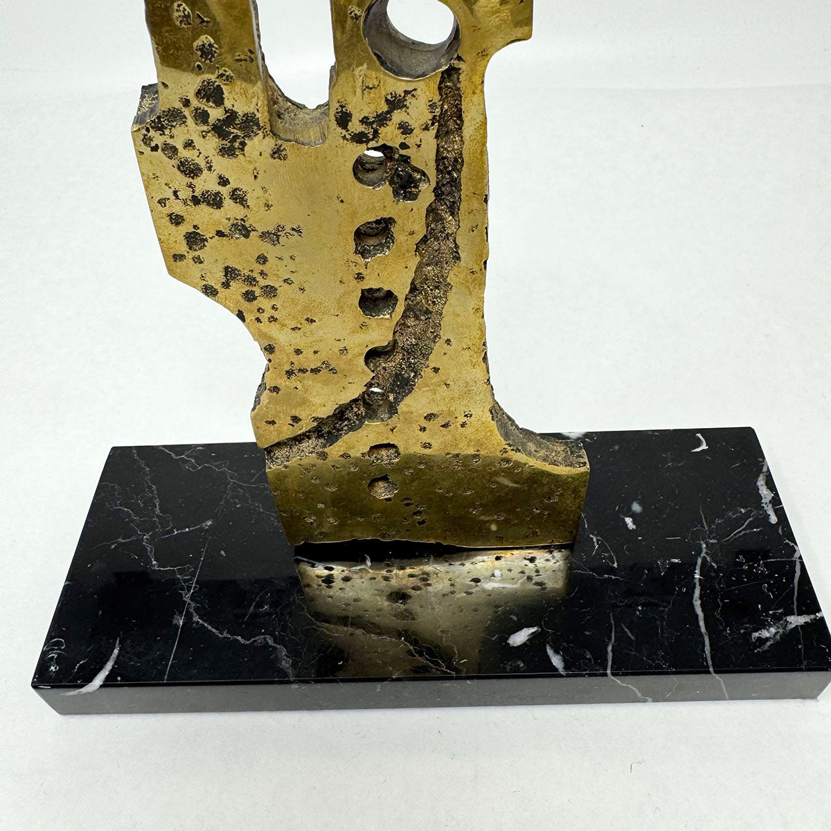 Brutalist Sculpture on a Marble Stand