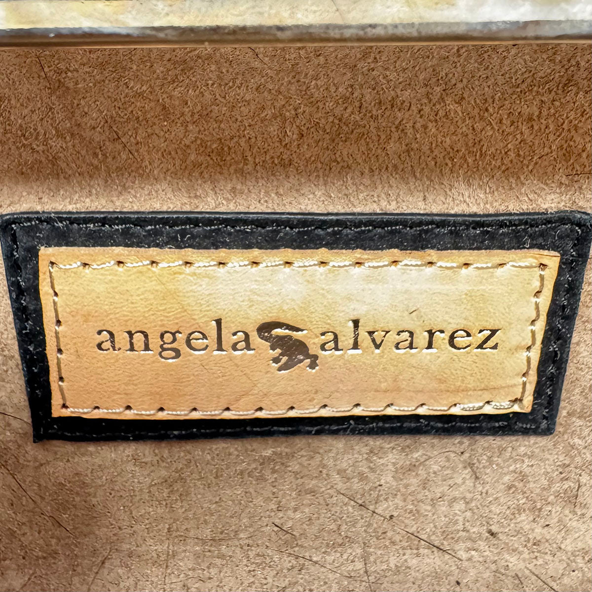 Angela Alvarez Clutch