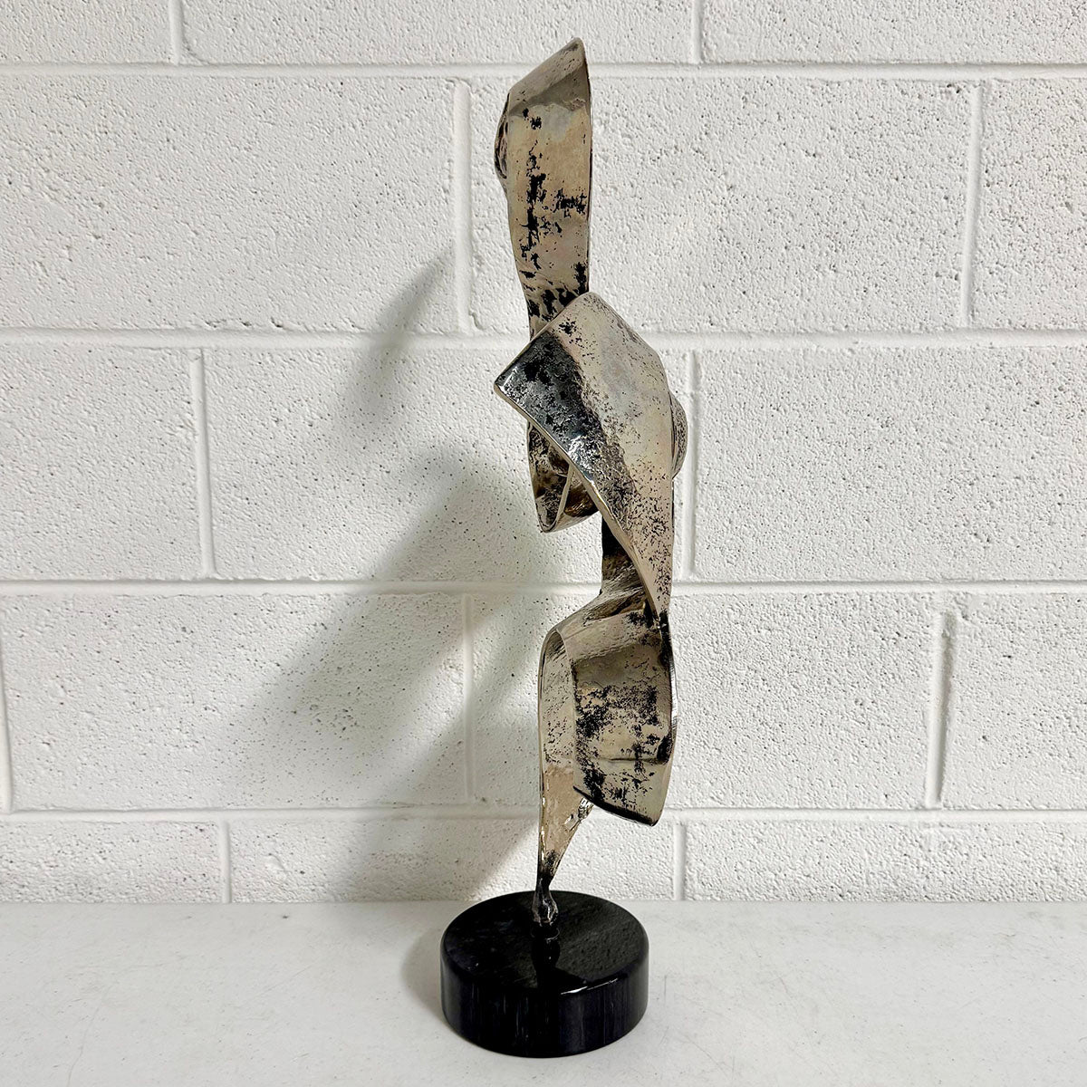 Abstract Brutalist Metal Ribbon Sculpture on base