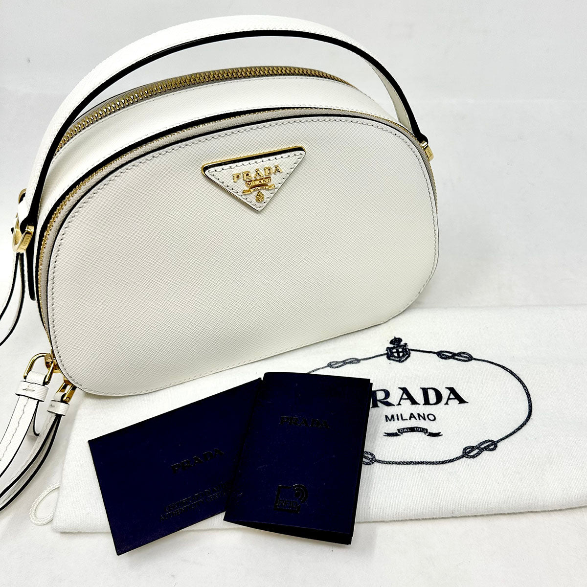 Prada Enameled Metal Triangle Odette Crossbody