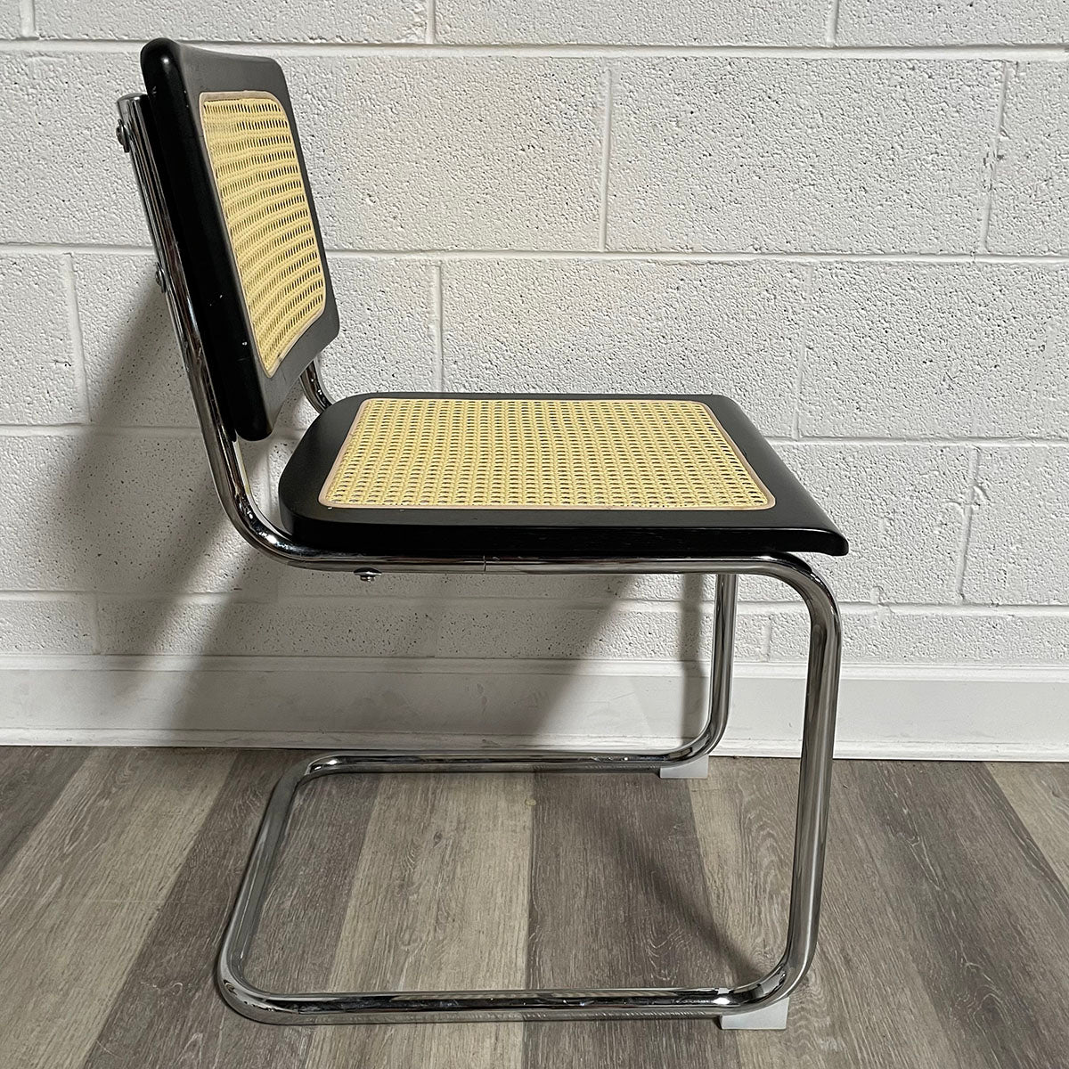 Pair of Black and Rattan Breuer Style Chairs