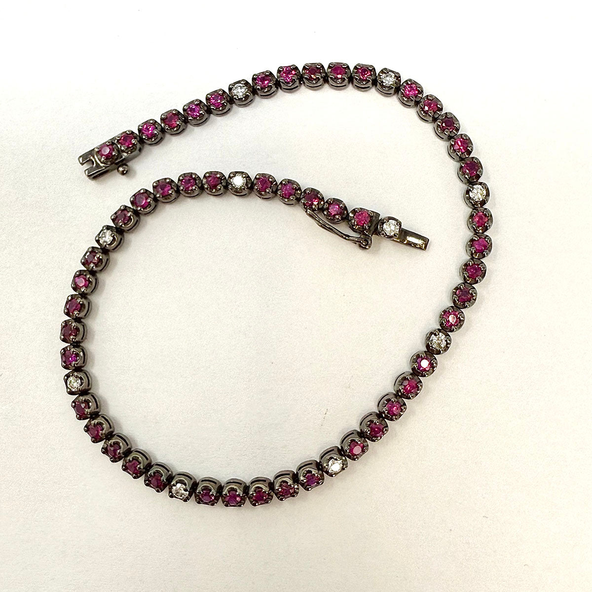 18K White Gold Tennis Bracelet with 51 Rubies and 10 Diamonds