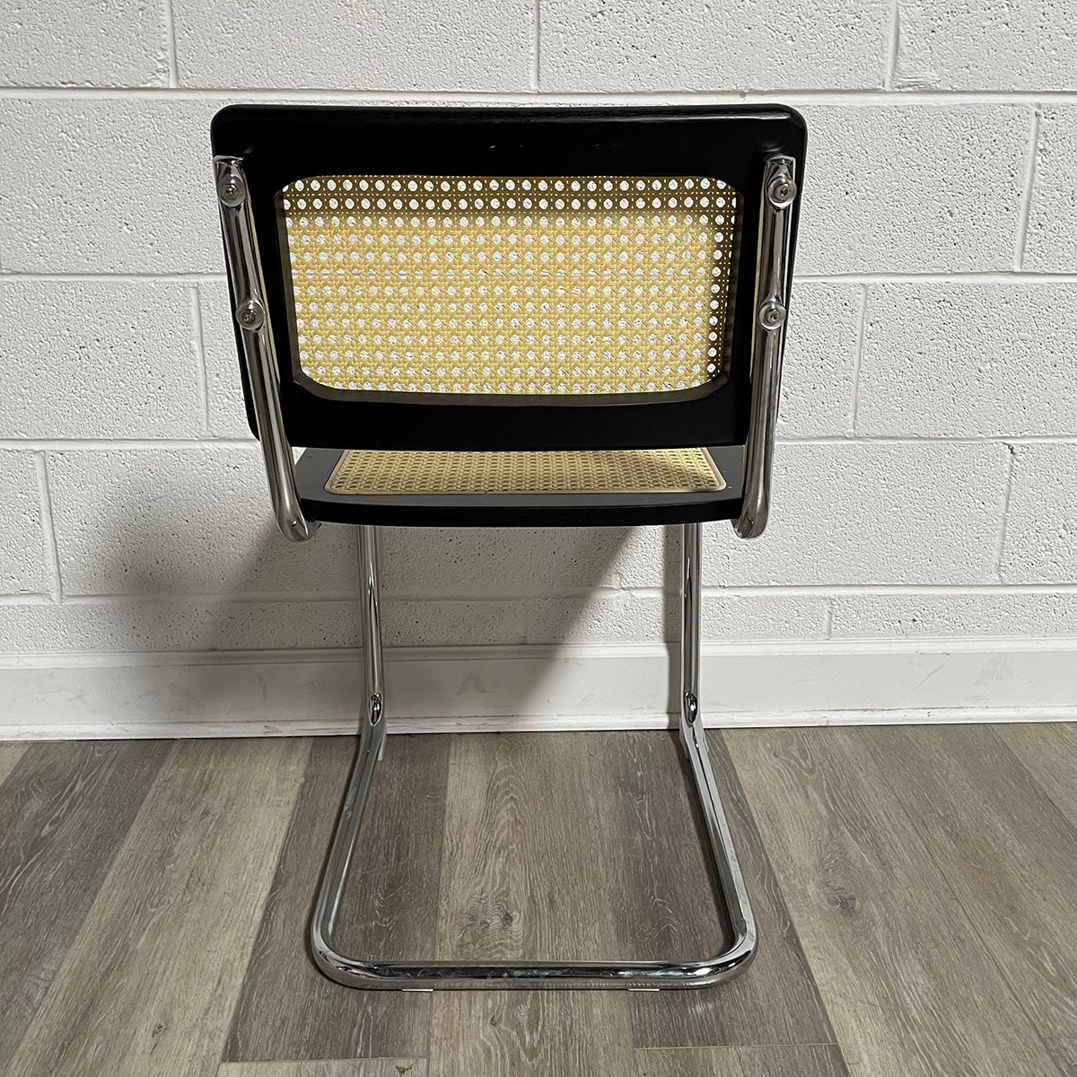 Pair of Black and Rattan Breuer Style Chairs