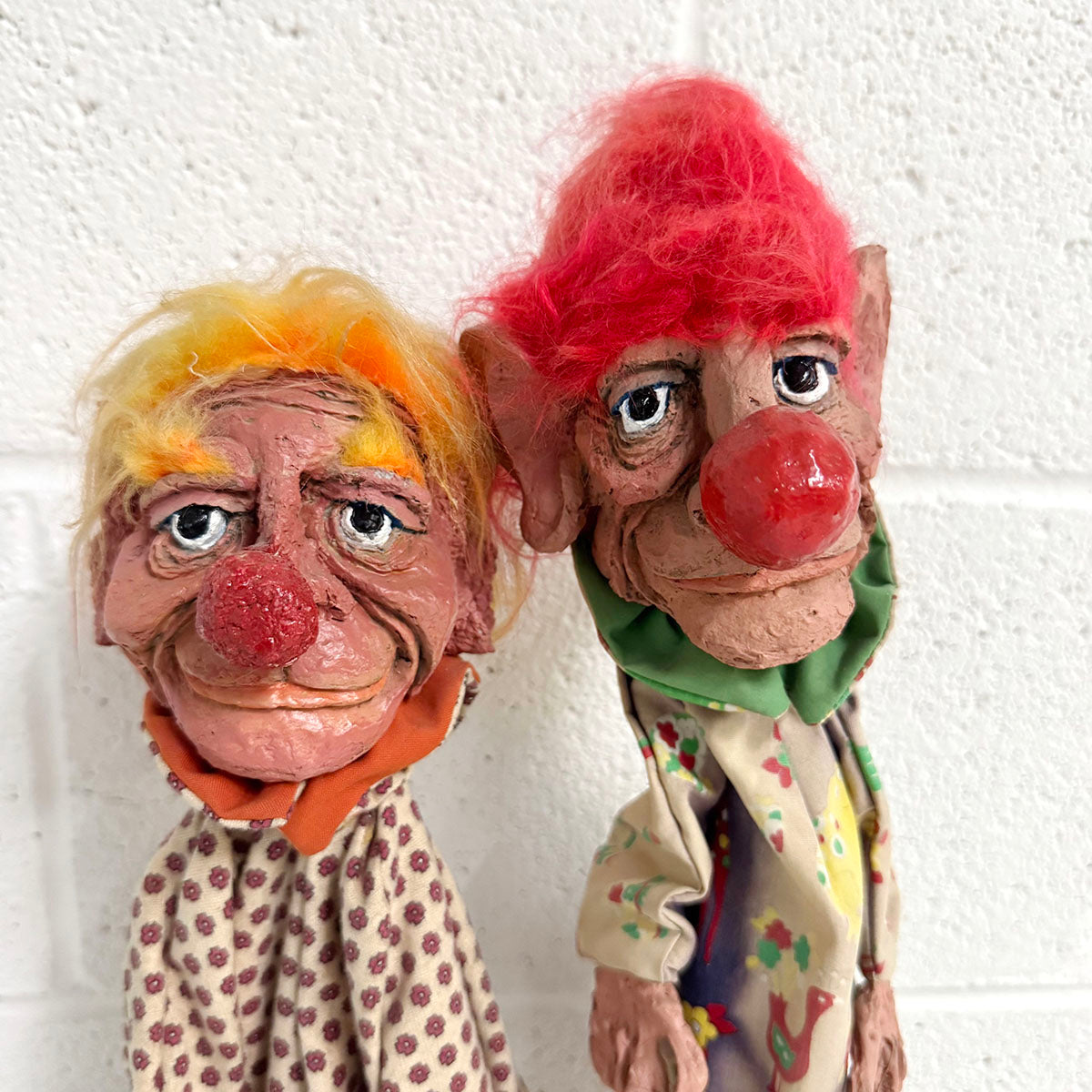 A Pair of Folk Art Clown Puppets on stand