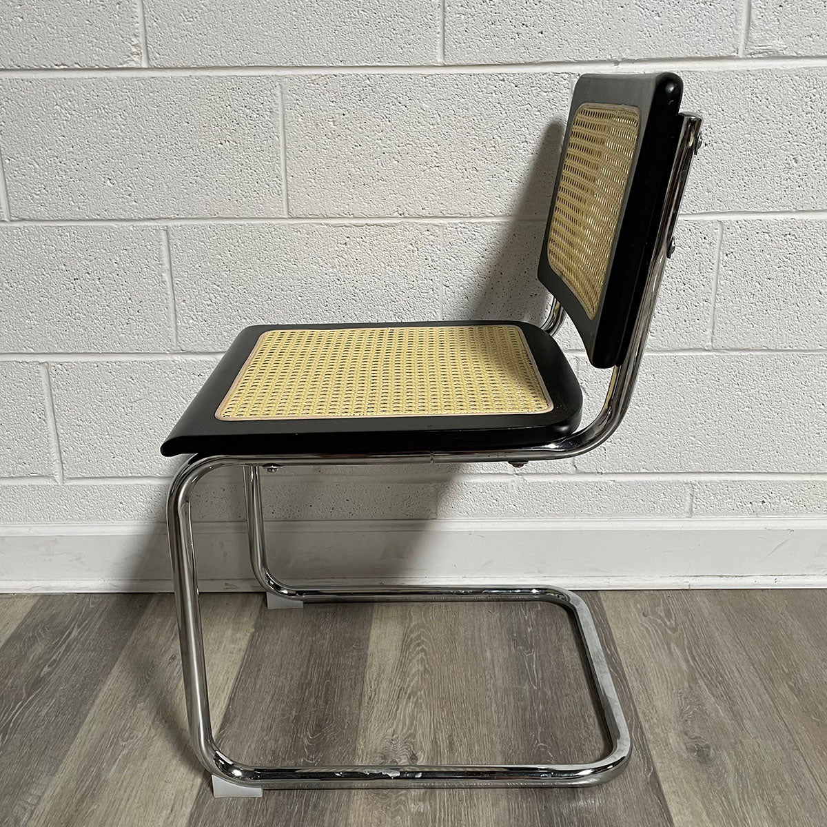 Pair of Black and Rattan Breuer Style Chairs