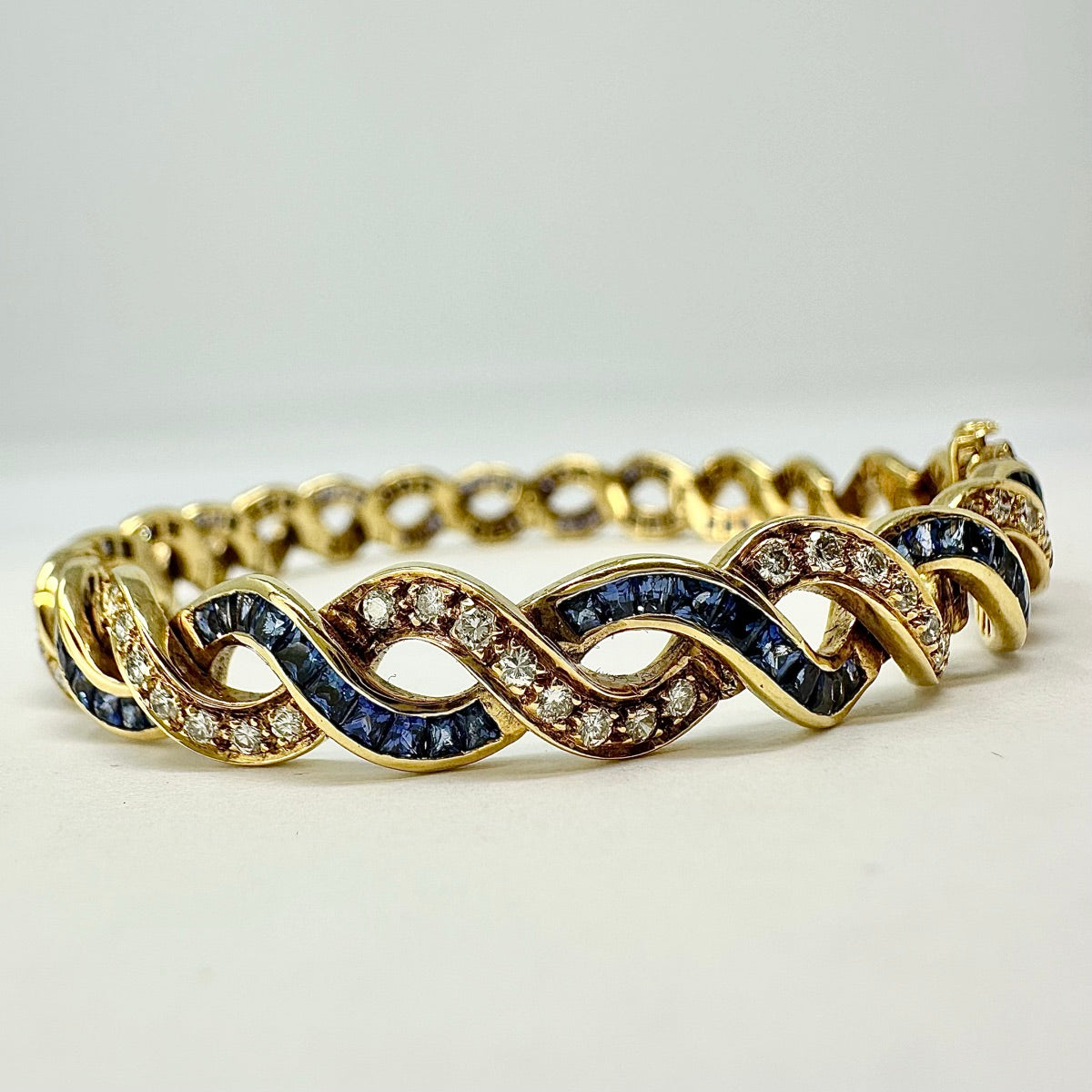 18K Gold Twist 5.25ct Sapphire and 1.54ct. Diamond Tennis Bracelet