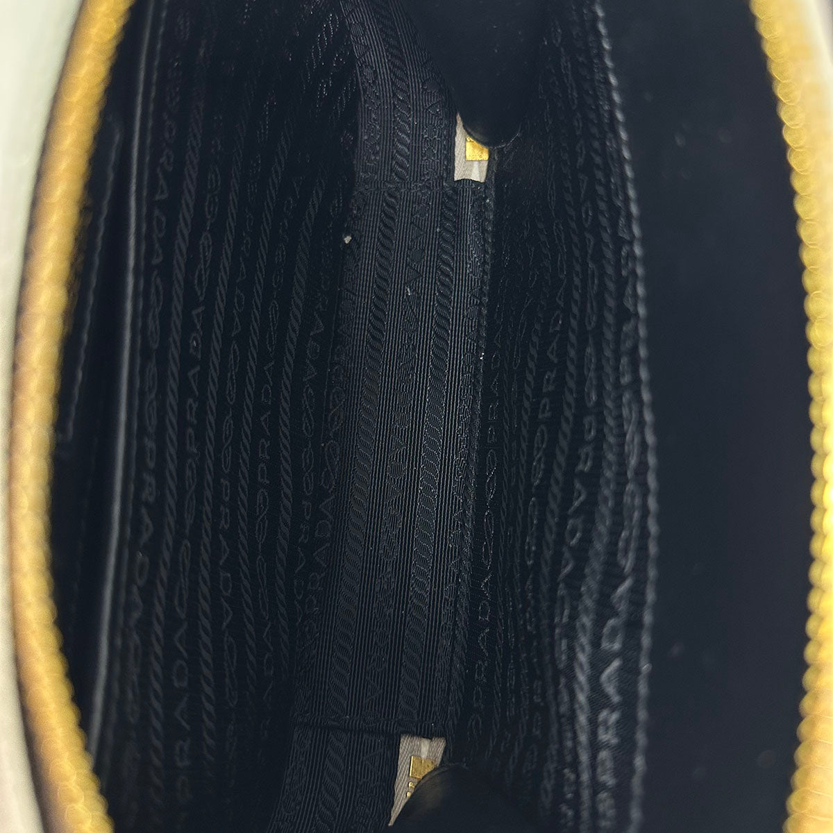 Prada Enameled Metal Triangle Odette Crossbody