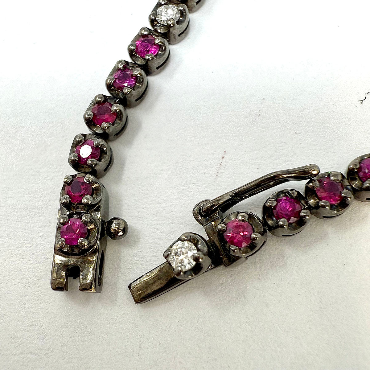 18K White Gold Tennis Bracelet with 51 Rubies and 10 Diamonds