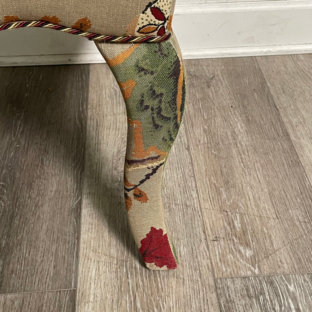 Upholstered Ottoman with Curved Legs and Botanical Print