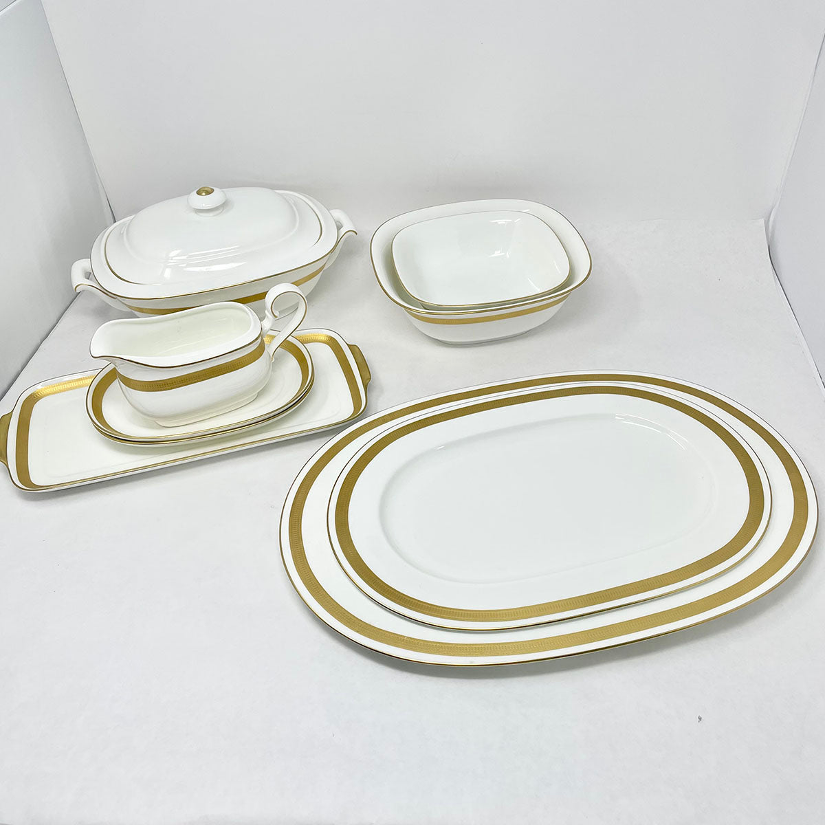 9 Serving Pieces of Gold Brocade China