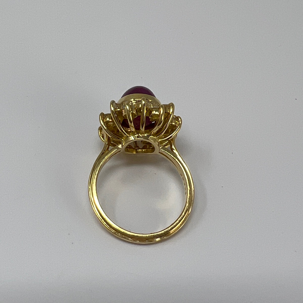 18K Gold Ring with Star Ruby and 16 Diamonds